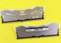 T-Force Delta RGB DDR5 memory modules on vibrant yellow surface.