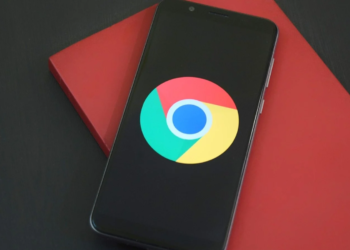 Smartphone displaying the Google Chrome logo, resting on a red box