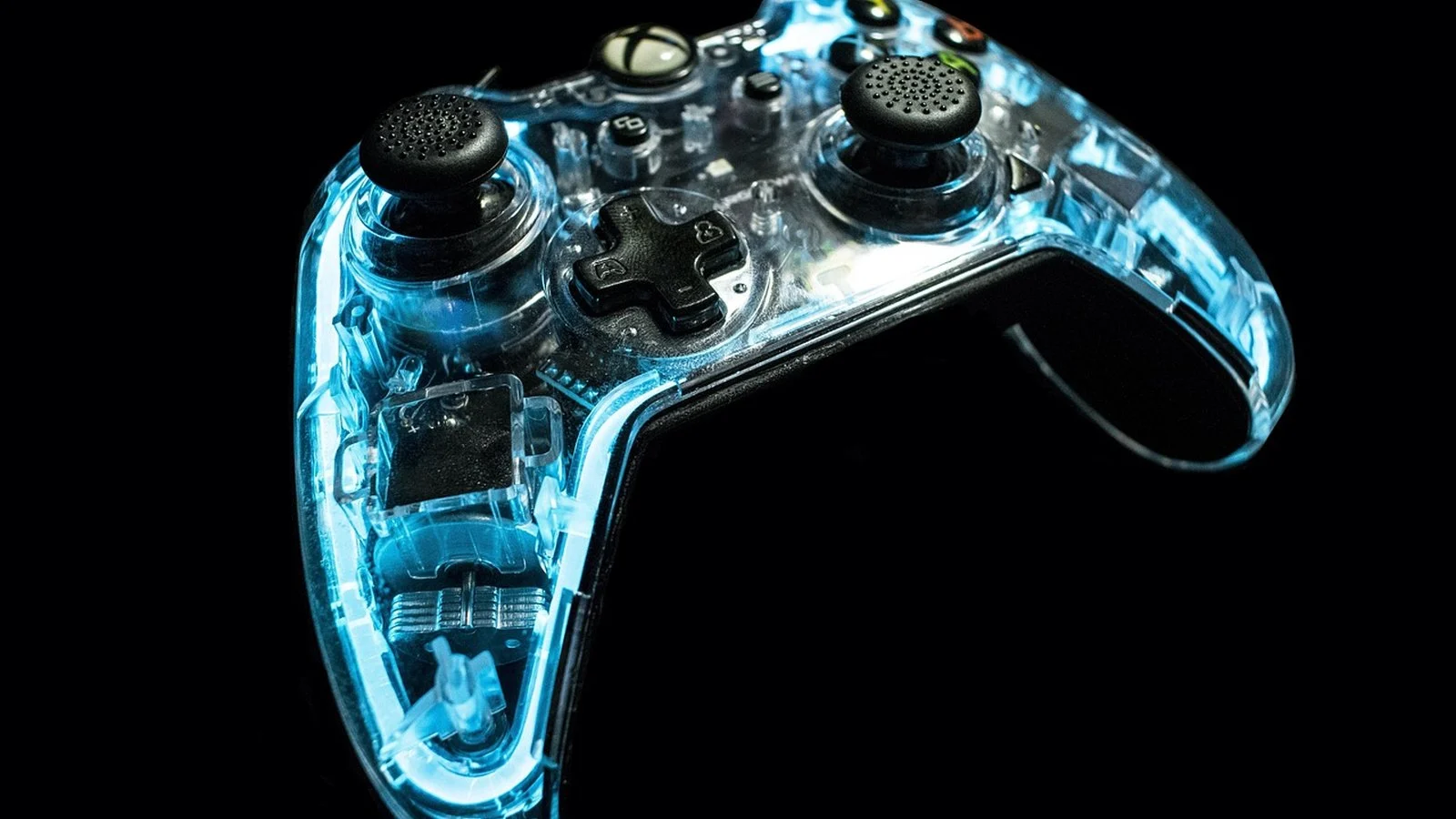 Translucent blue-lit Xbox controller glowing against a black background