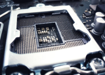 Empty CPU socket with pin array and metal retention bracket on a motherboard