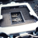 Empty CPU socket with pin array and metal retention bracket on a motherboard