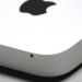 Close-up of a silver aluminum device corner with the Apple logo on top