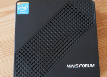 Black Minisforum mini PC with mesh vent pattern and Intel Inside sticker, viewed from above