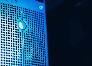 Close-up of a blue-lit perforated server panel with a teardrop-shaped LED indicator