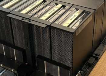 Large black finned NVIDIA GPU heatsink modules mounted on a server motherboard