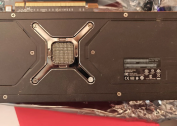 Backplate of an AMD Radeon RX 480XT Black Edition graphics card lying on foil packaging