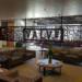 Valve office lobby with a laser-cut metal Valve logo wall and lounge seating
