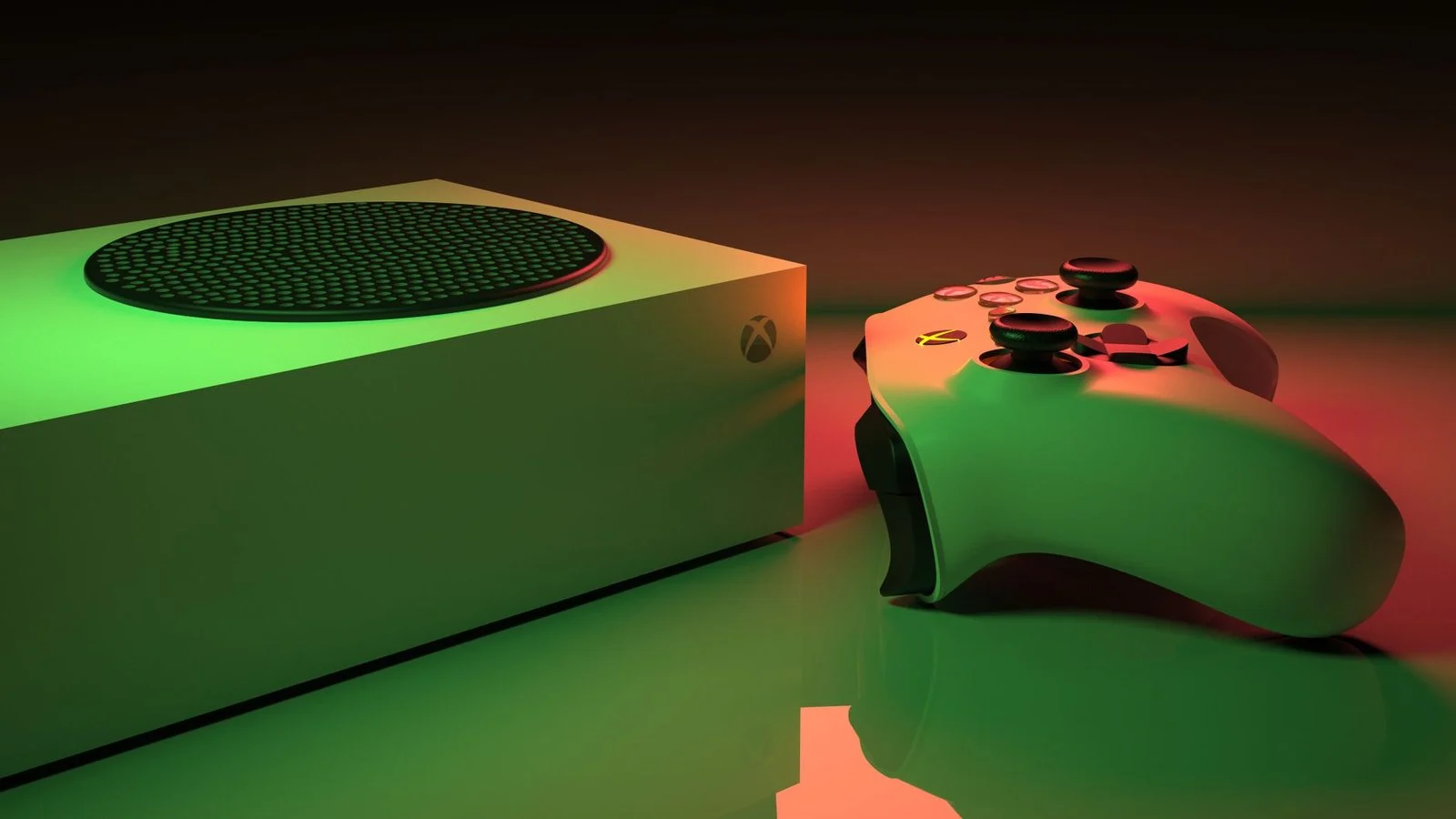 Green-lit rectangular game console and matching controller on a reflective surface