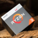 AMD Ryzen 3 processor retail box with Radeon Vega Graphics branding, resting on driftwood