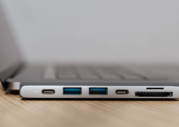 Close-up of a laptop's side ports: two USB-C, two USB-A, and an SD card slot