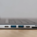 Close-up of a laptop's side ports: two USB-C, two USB-A, and an SD card slot