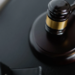 Wooden gavel resting on its sound block on a dark table