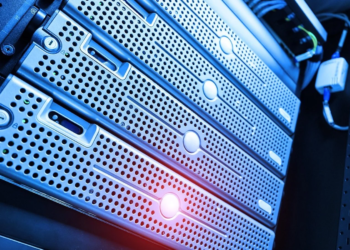 Close-up of a generic silver rack-mounted server chassis with perforated panels under blue and red lighting