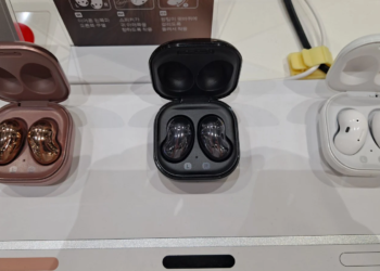 Three Samsung earbud cases with bean-shaped in-ear buds on a display table