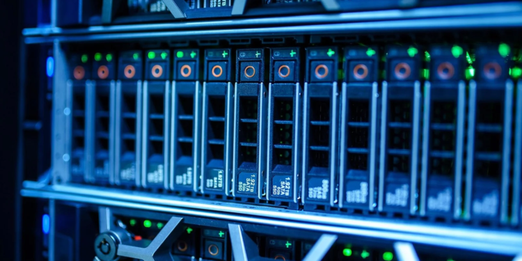 Close-up of blue-lit server rack with rows of hot-swappable SSD drive trays