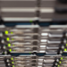 Close-up of server rack with blinking green status LEDs, blurred foreground and background
