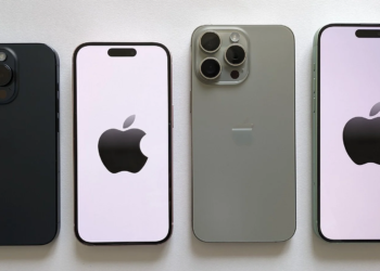 Four iPhones laid flat for comparison: dark blue, white with lavender screen, sage green, and green