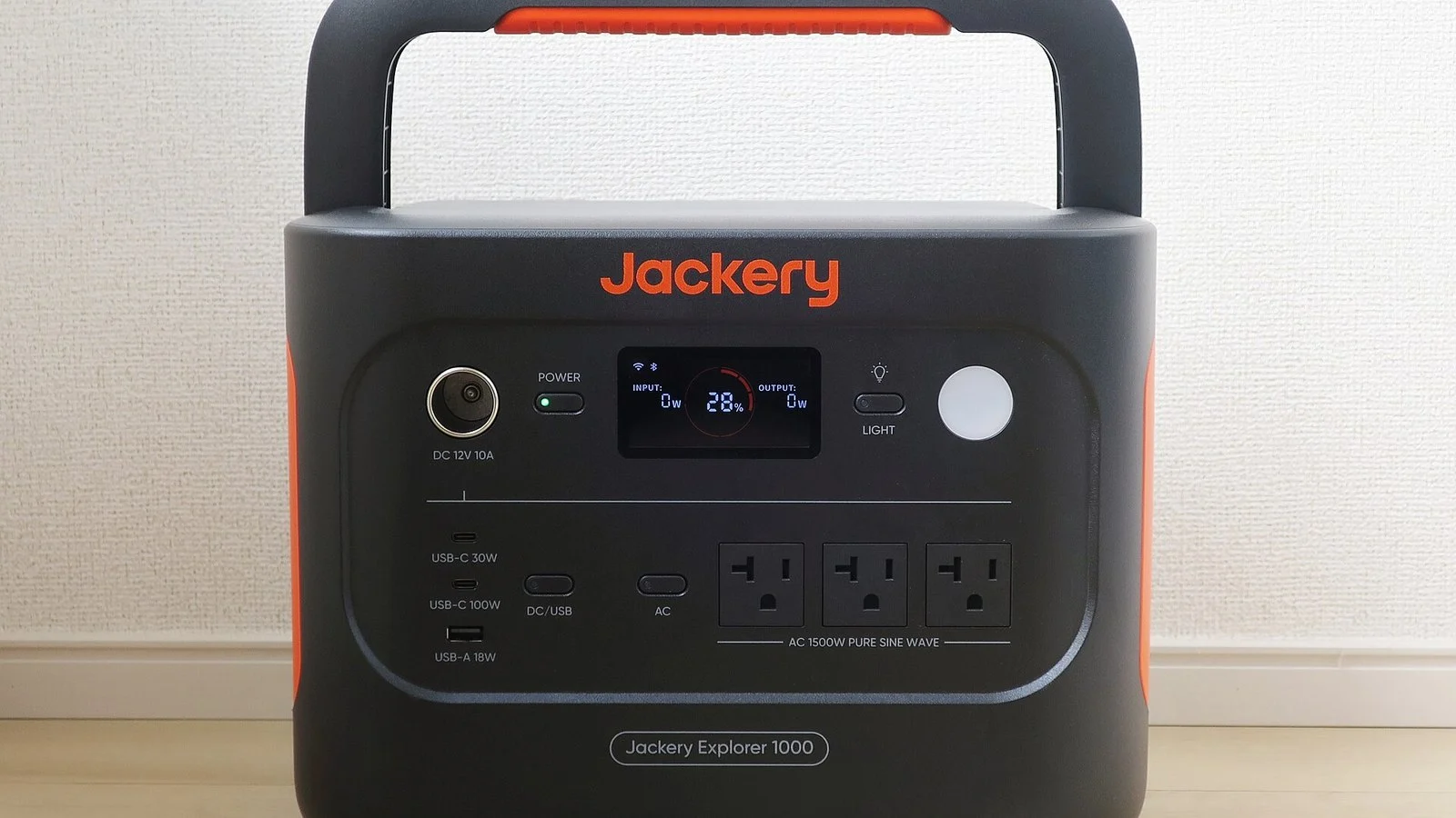 Black and orange Jackery Explorer 1000 portable power station with display panel and outlets