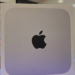 Sealed white Apple product box with black Apple logo on a store shelf