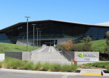 Nvidia's headquarters entrance with a triangular glass roof and Nvidia logo sign