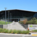 Nvidia's headquarters entrance with a triangular glass roof and Nvidia logo sign
