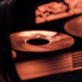Close-up of spinning graphics card cooling fans lit in orange, RTX logo partially visible