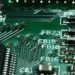 Close-up of a green circuit board showing ferrite bead labels FB15, FB16, FB18, FB23 and surface-mount components
