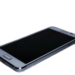 Silver Android smartphone with screen off, physical home button, lying face-up at an angle