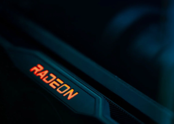 Close-up of a dark graphics card edge with an illuminated red-orange Radeon logo