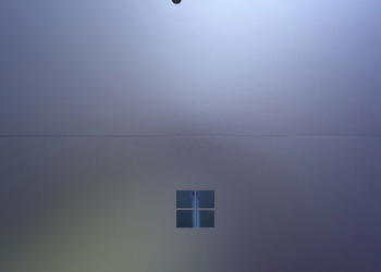 Extreme close-up of a Windows device's grey metal back panel with the Windows logo