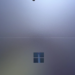 Extreme close-up of a Windows device's grey metal back panel with the Windows logo