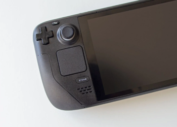Close-up of a black Steam Deck handheld console's controls and screen, powered off