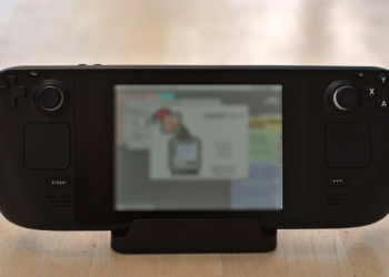 Steam Deck handheld console in its dock with the screen displaying a webpage