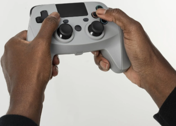 Hands holding a generic gray game controller against a white background